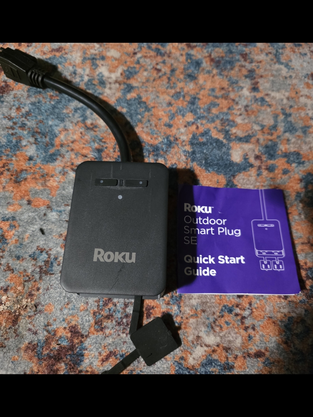 Roku Outdoor Smart Plug SE in Black with Purple Guide
